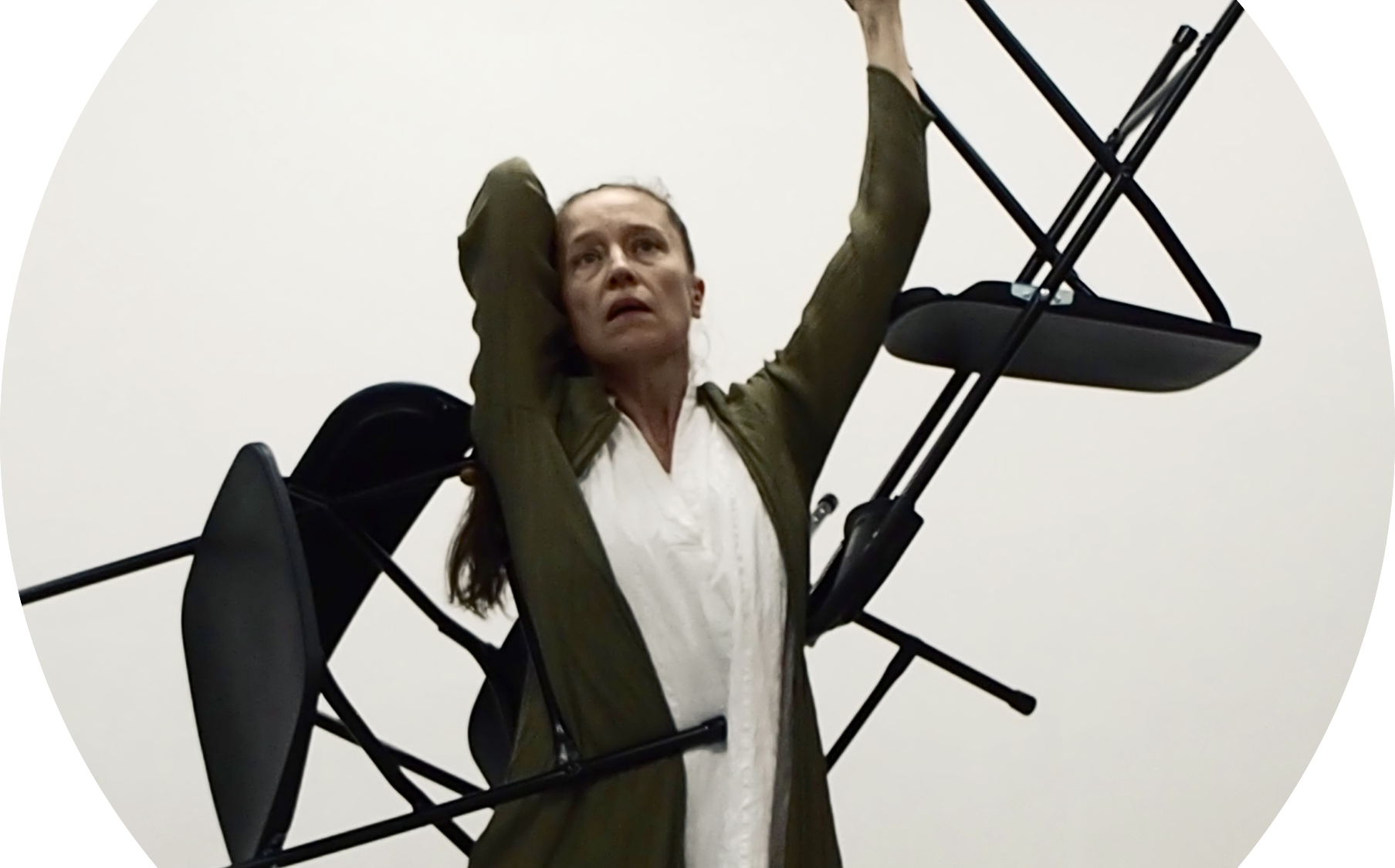 Jessica dances carrying chairs